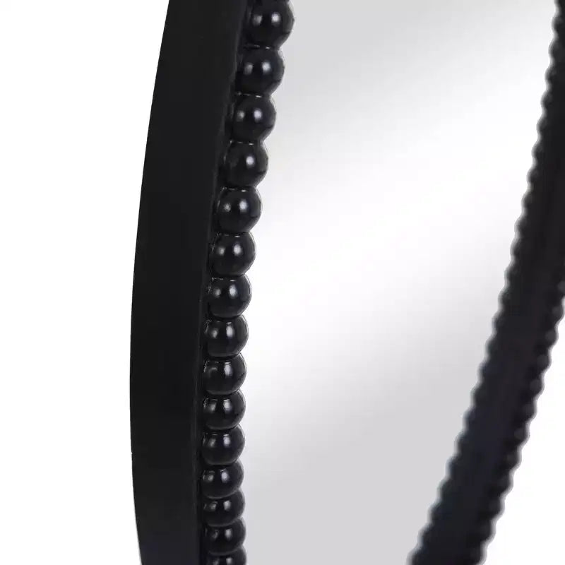 Miroir ovale en bois avec bordure perlée noire