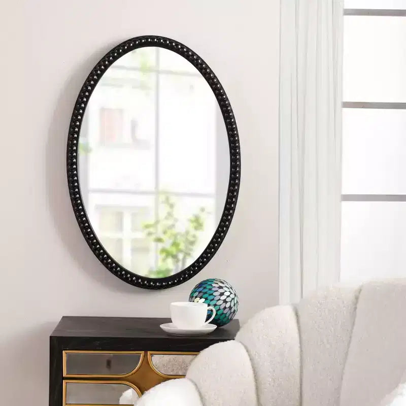 Miroir ovale en bois avec bordure perlée noire